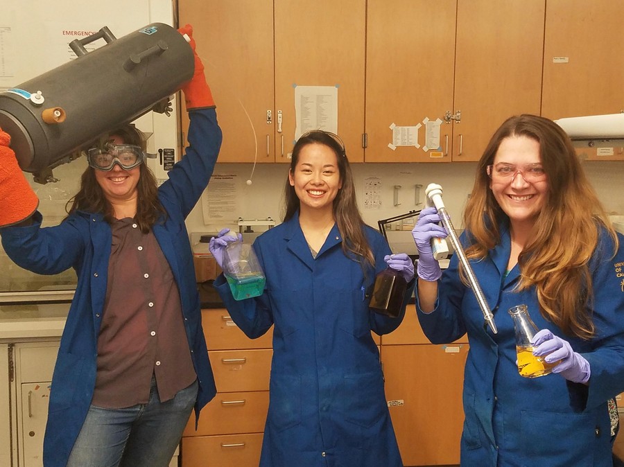 Jenna and fellow scientists posing in the laboratory