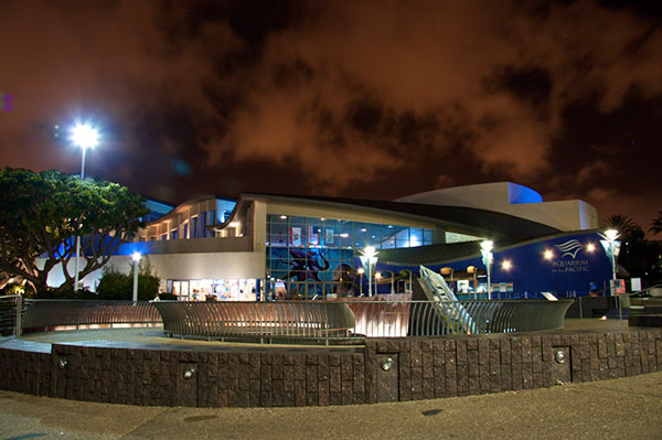 Aquarium exterior at night with red sky