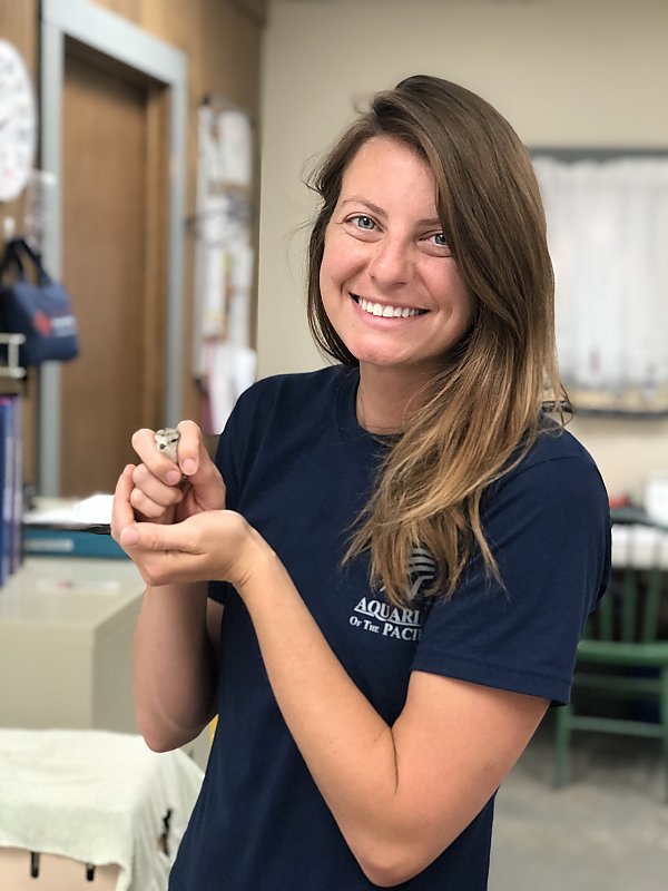 Mammalogist Katie Finch holding chick