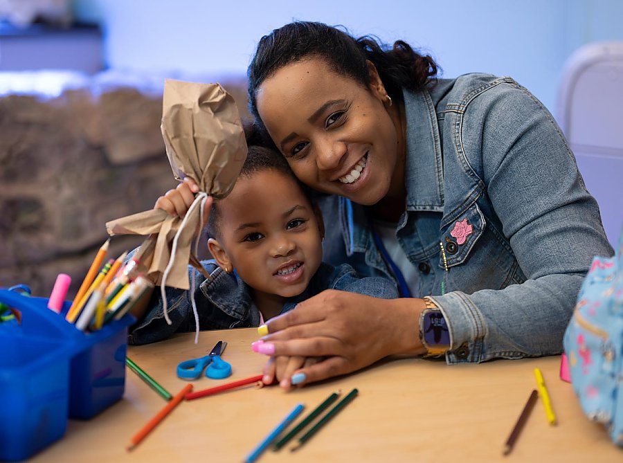 mother and young daughter crafting together