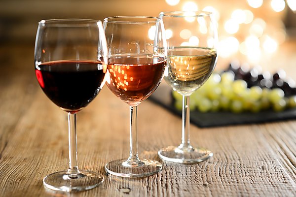 Three wine glasses on table