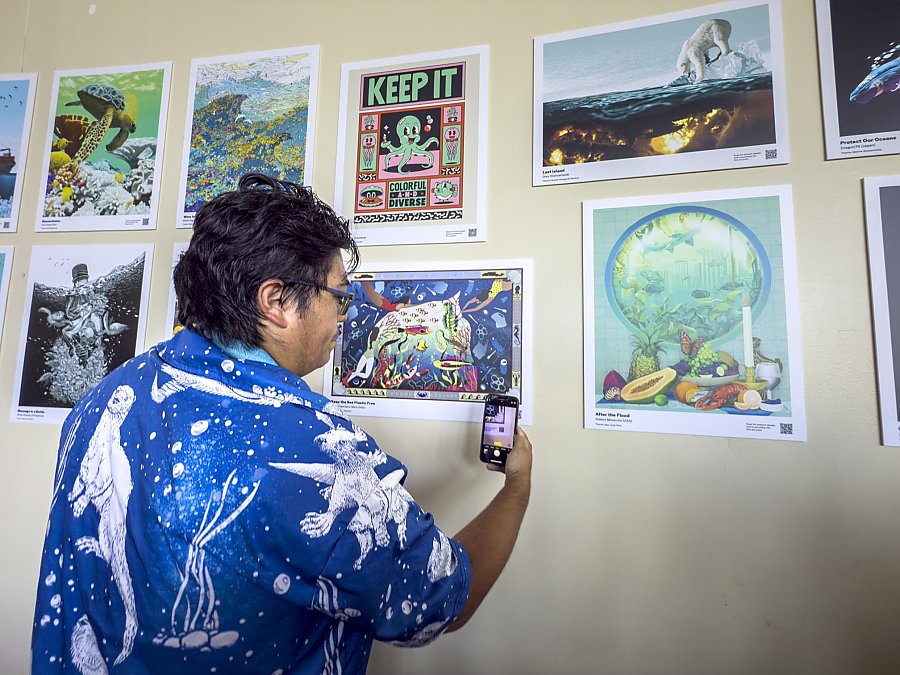 Person scanning a QR code on an art print