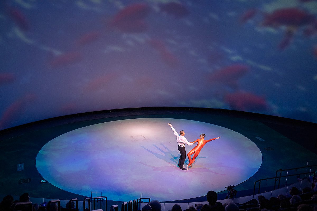 Long Beach Ballet performers dance on a round stage
