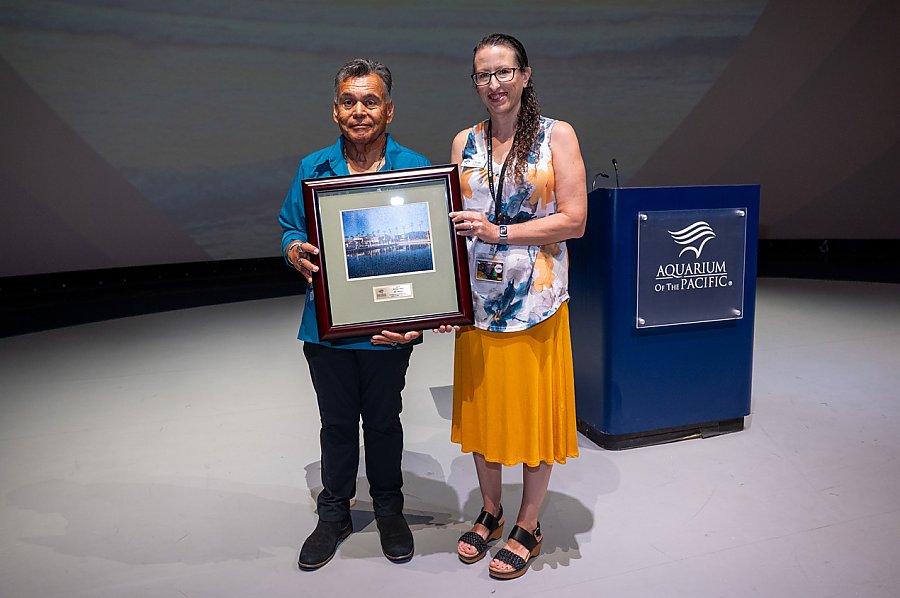 Two people holding Moompetam Festival 2025 Heritage Award