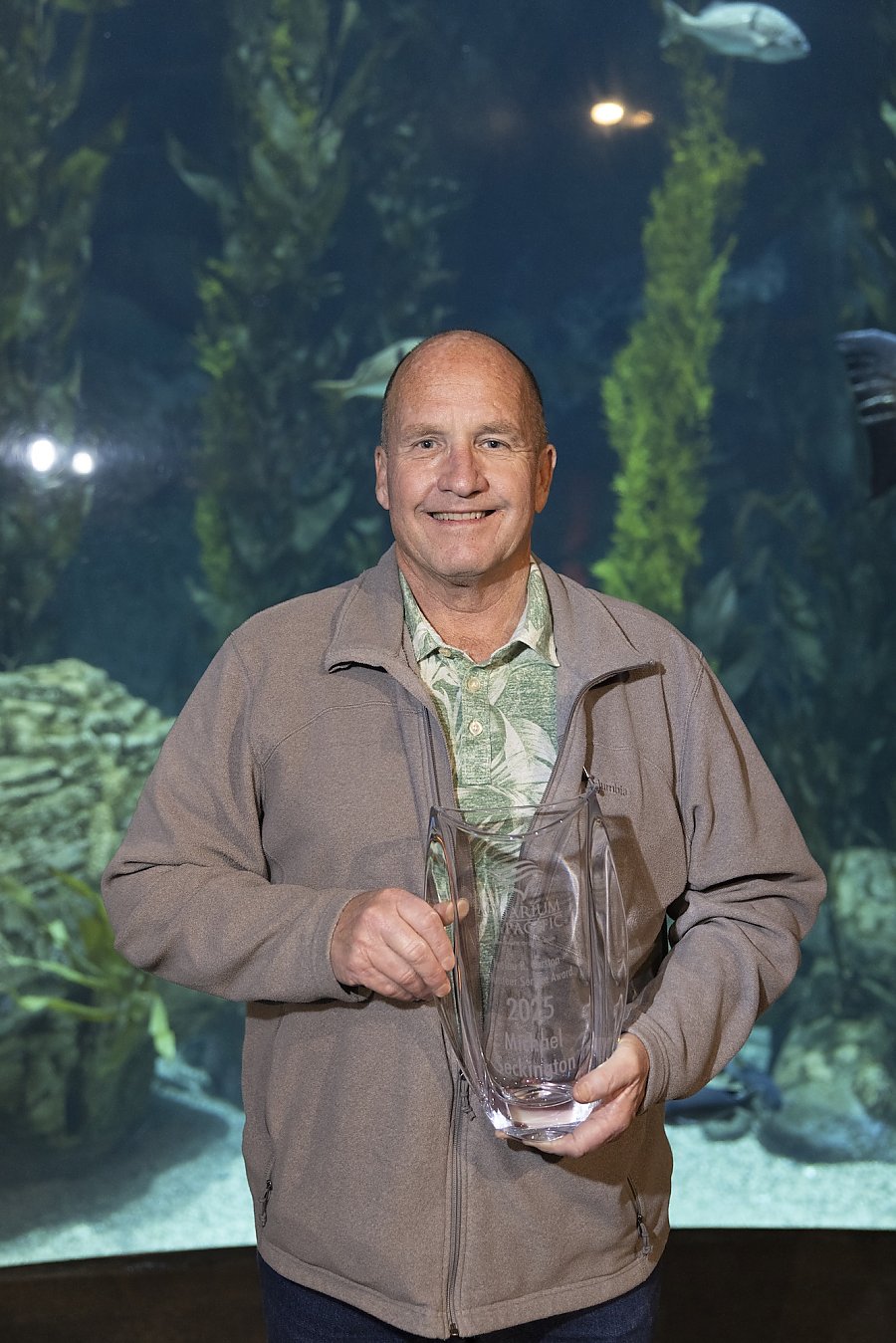 Mike Seckington holding his Ivolou R Corsten Award