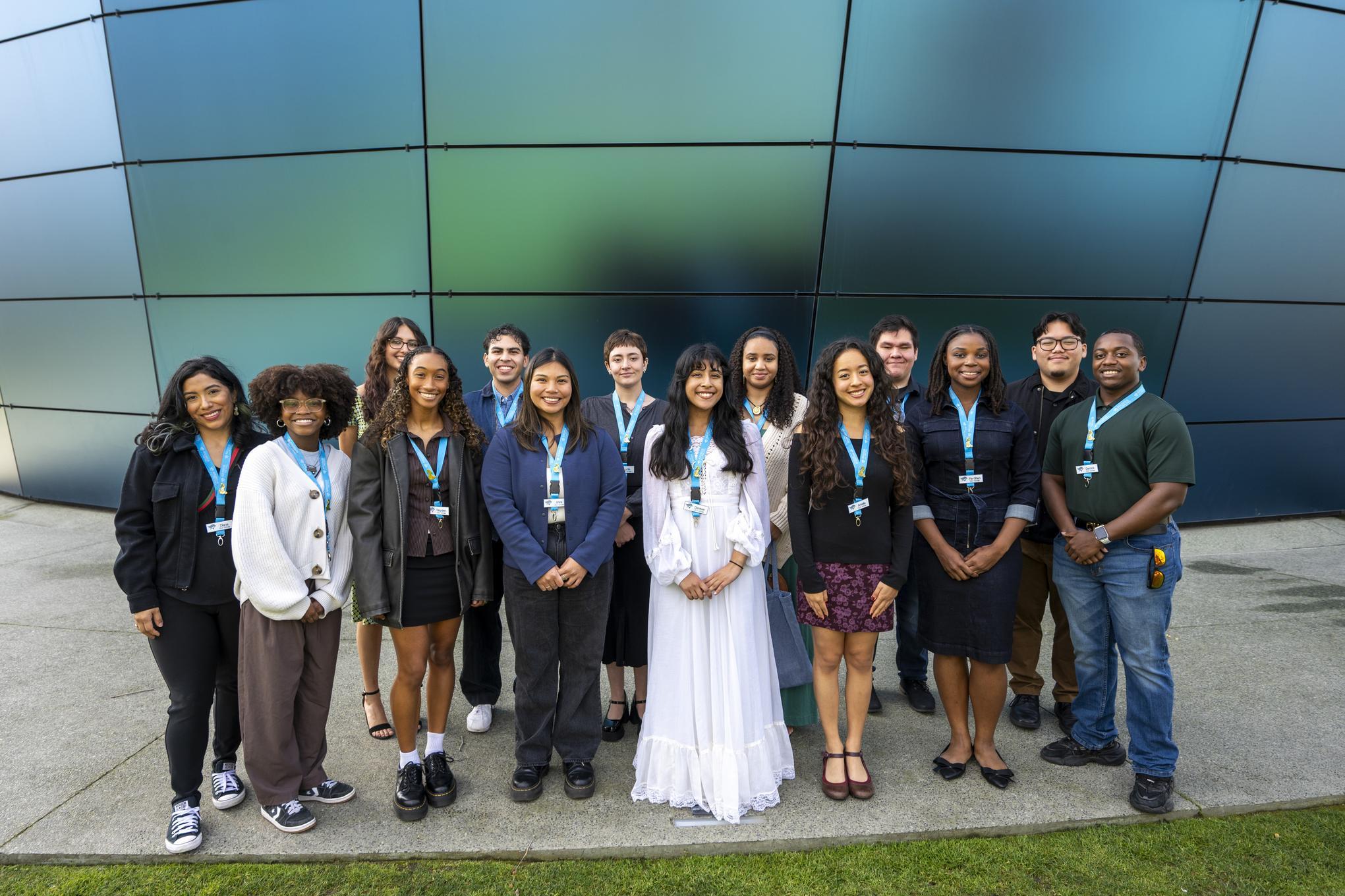 Group of people dressed up wearing blue lanyards