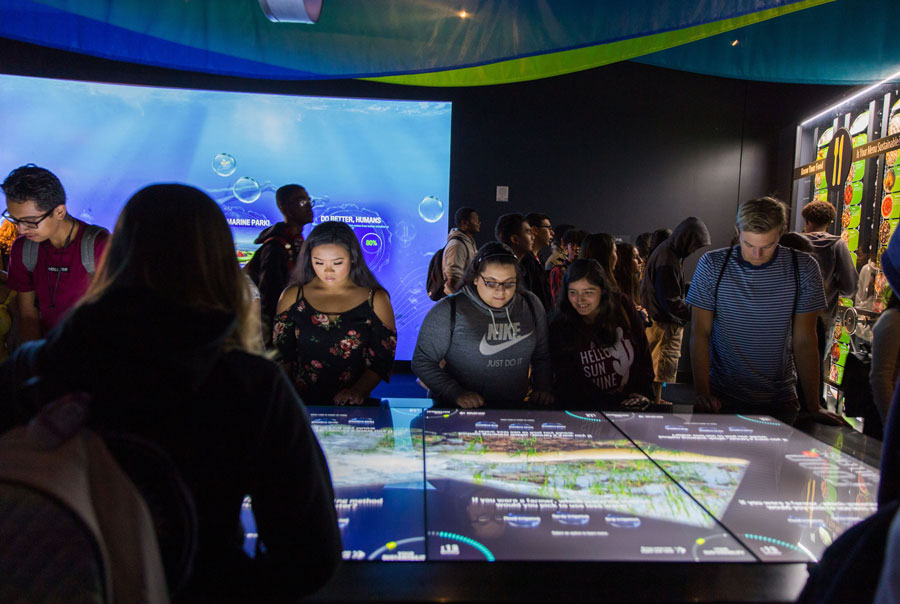 Visitors explore interactive exhibits