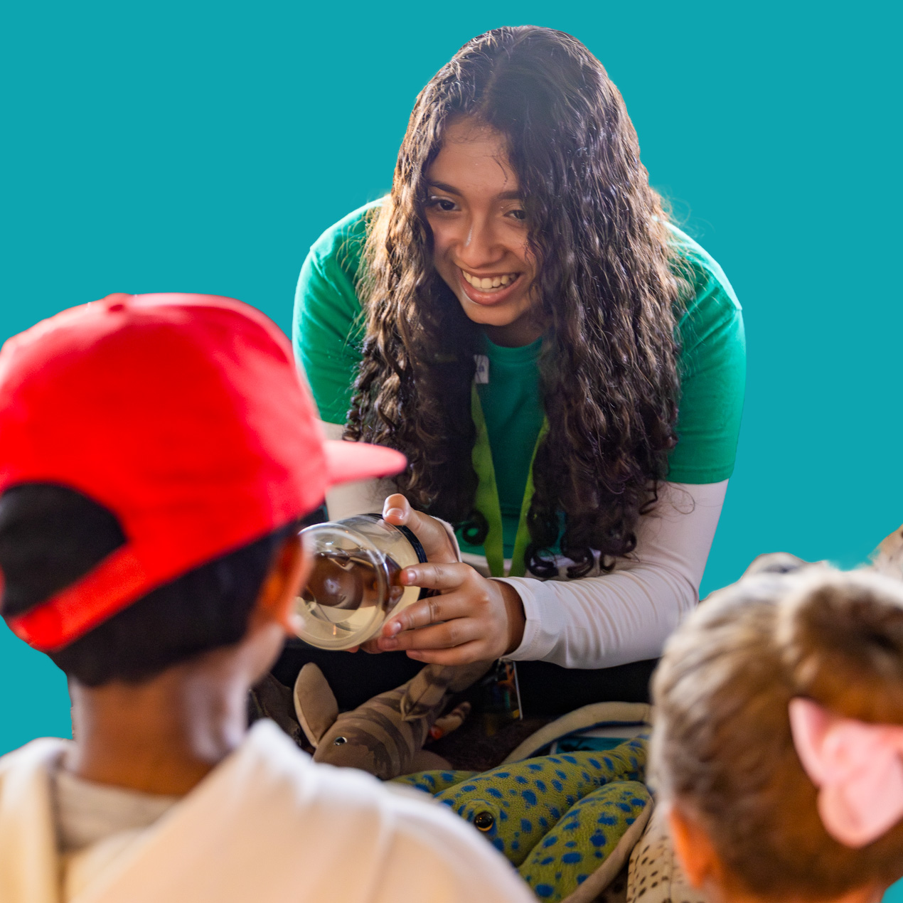 volunteer staff educating kids